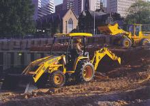 Rovokopači-utovarivači John Deere Construction 110