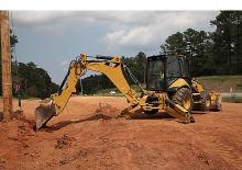 Rovokopači-utovarivači Caterpillar 450F